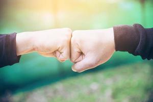 Man touching - holding hand together for success commitment work concept photo