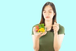 Happy lady holding kichen stuff over copy space background - people home made food preparation concept photo