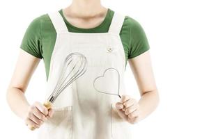 Happy lady holding kichen stuff over copy space background - people home made food preparation concept photo