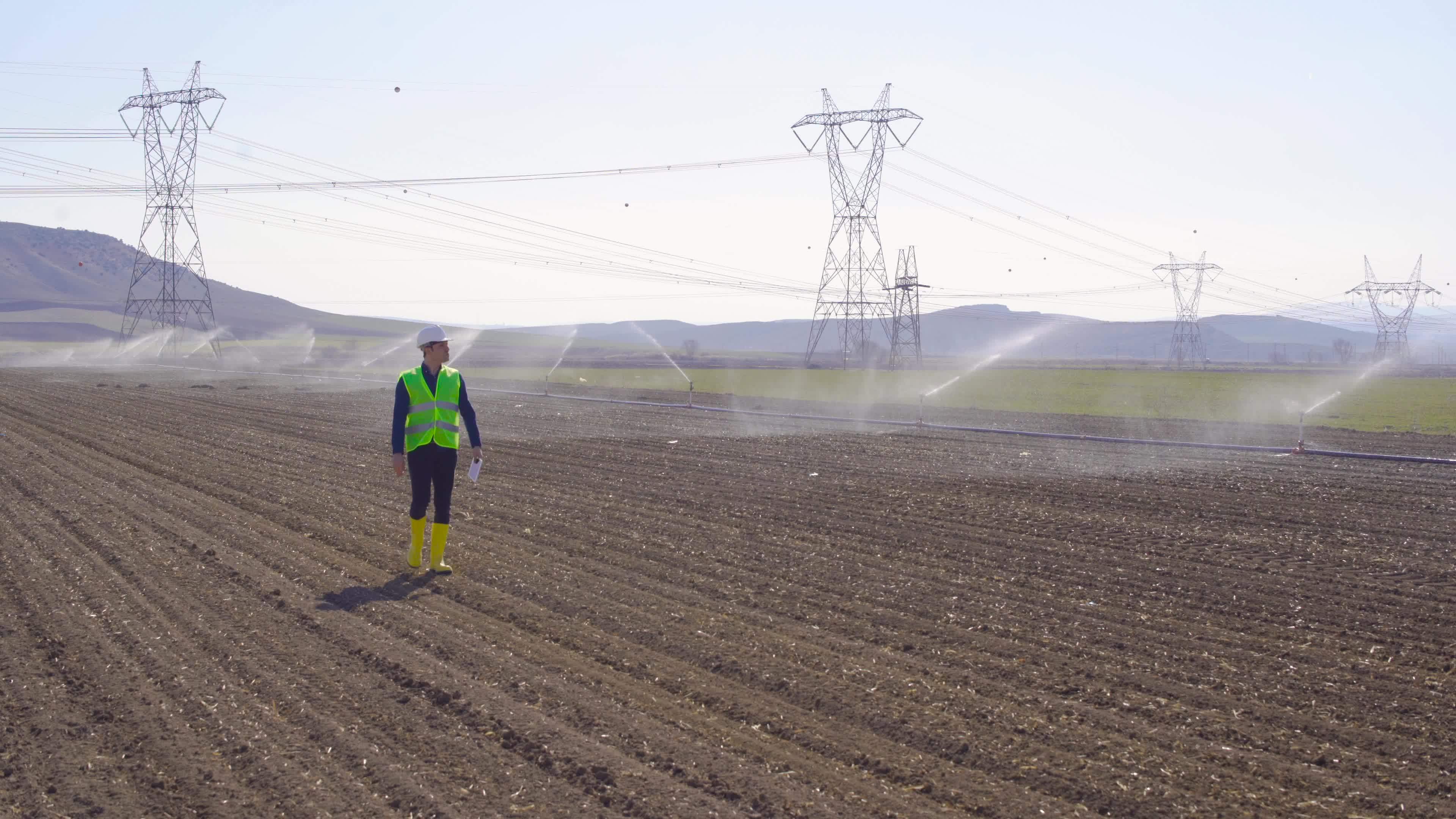 Engineer in agricultural irrigation and farmland. The engineer looks