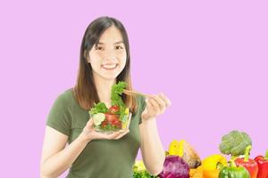 Happy lady holding kichen stuff over copy space background - people home made food preparation concept photo