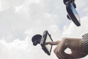 Man driving car using navigator photo