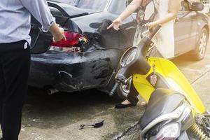 Accident of motorcycle and car photo