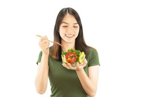 Happy lady holding kichen stuff over copy space background - people home made food preparation concept photo
