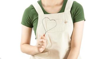 Happy lady holding kichen stuff over copy space background - people home made food preparation concept photo