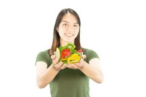 Happy lady holding kichen stuff over copy space background - people home made food preparation concept photo