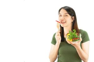 Happy lady holding kichen stuff over copy space background - people home made food preparation concept photo