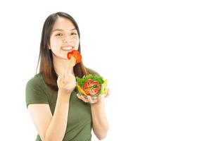 Happy lady holding kichen stuff over copy space background - people home made food preparation concept photo