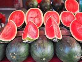 Pile of fresh watermelon for sale in the market photo