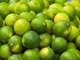 Full frame photo of fresh green lemon for sale in the market