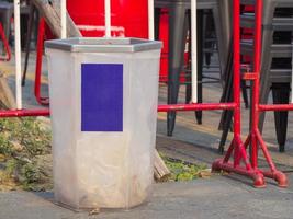 Trash on the concrete floor in the park photo