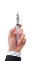 hand holding syringe filled with currency photo