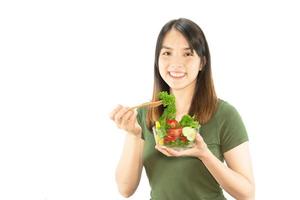 Happy lady holding kichen stuff over copy space background - people home made food preparation concept photo