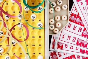 Bingo game with cards to play and serpentines. Horizontal image viewed from above. photo