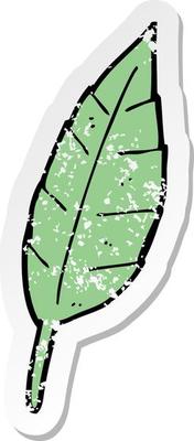 retro distressed sticker of a cartoon leaf