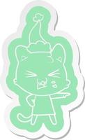 cartoon  sticker of a hissing cat wearing santa hat vector