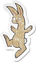 retro distressed sticker of a funny cartoon rabbit vector