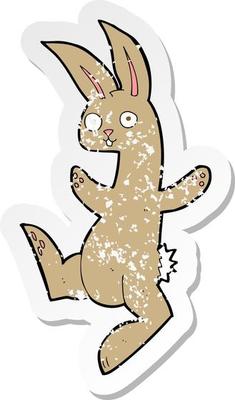retro distressed sticker of a funny cartoon rabbit