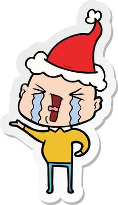 sticker cartoon of a crying bald man wearing santa hat