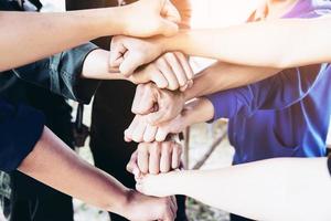 Man touching - holding hand together for success commitment work concept photo