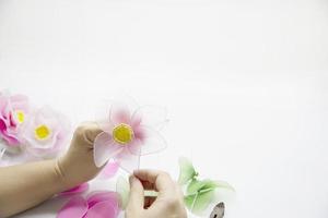 Woman making beautiful nylon flower - people with DIY handmade flower concept photo