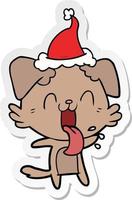 sticker cartoon of a panting dog wearing santa hat vector