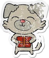 distressed sticker of a cartoon dog with present vector