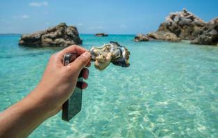 Close-up of someone hand holding a fresh oyster shell in Arnhem land of Northern territory state of Australia. photo