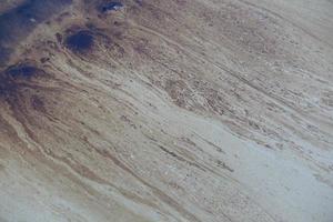 Gulf oil spill is shown on a beach photo