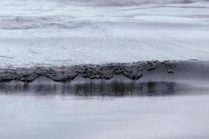 crude oil spill on the beach photo