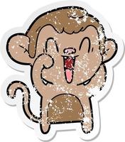 distressed sticker of a cartoon laughing monkey vector
