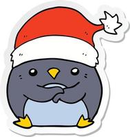 pegatina de un lindo pingüino de dibujos animados con sombrero de navidad vector