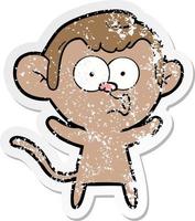 distressed sticker of a cartoon surprised monkey vector