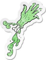 retro distressed sticker of a cartoon gross zombie hand vector