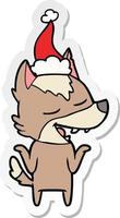 sticker cartoon of a wolf laughing wearing santa hat vector