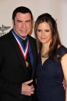 LOS ANGELES, JAN 18 -  John Travolta, Kelly Preston arrives at the Living Legends of Aviation Gala at Beverly Hilton Hotel on January 18, 2013 in Beverly Hills, CA photo