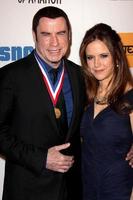 LOS ANGELES, JAN 18 -  John Travolta, Kelly Preston arrives at the Living Legends of Aviation Gala at Beverly Hilton Hotel on January 18, 2013 in Beverly Hills, CA photo