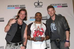 LOS ANGELES, NOV 24 -  Tyler Hubbard, Nelly, Brian Kelly at the 2013 American Music Awards Press Room at Nokia Theater on November 24, 2013 in Los Angeles, CA photo