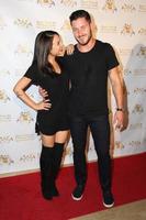 LOS ANGELES, SEP 10 -  Janel Parrish, Valentin Chmerkovskiy at the Dance With Me USA Grand Opening at Dance With Me Studio on September 10, 2014 in Sherman Oaks, CA photo