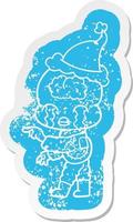 cartoon distressed sticker of a big brain alien crying and pointing wearing santa hat vector