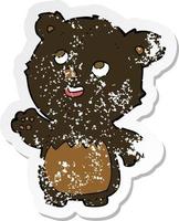 retro distressed sticker of a cartoon happy little teddy black bear vector