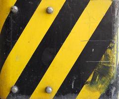 yellow and black bars sign background photo