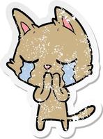 distressed sticker of a crying cartoon cat vector