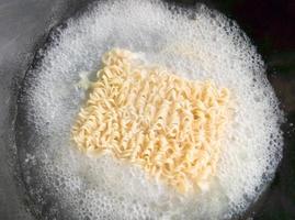 Instant noodle is boiled in the pan. photo