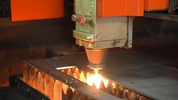 General view of the laser cutting machine. The view of the laser cutting machine in operation, sparks as it cuts the metal. video