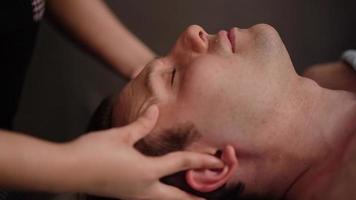 Man getting a relaxing massage. Getting a professional massage at the spa. video