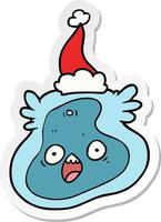 sticker cartoon of a germ wearing santa hat vector