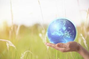 Earth globe in hands. World environment day. photo