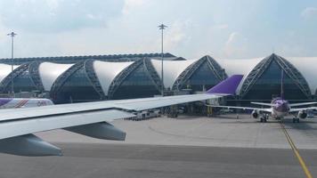 BANGKOK, THAILAND NOVEMBER 30, 2017 - Airplanes in Suvarnabhumi airport, view fom taxiing aircraft video