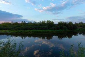 Sunset in the wild on the river. photo